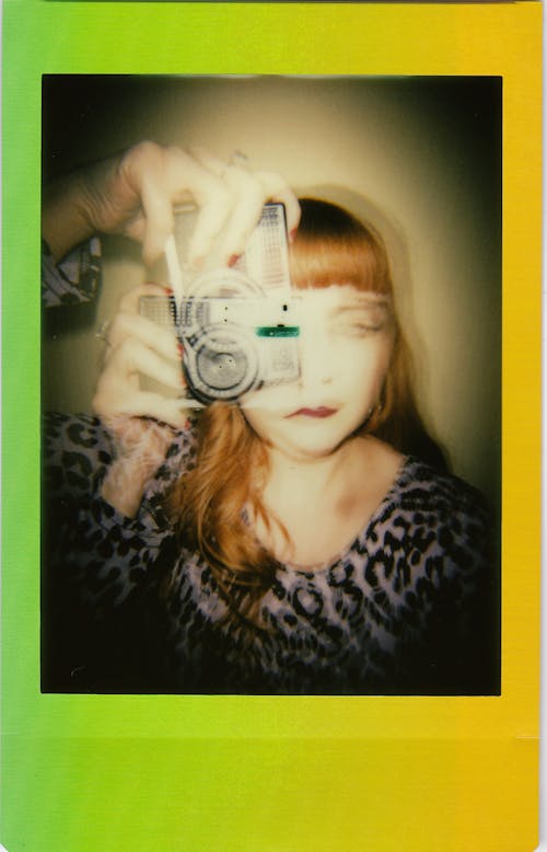 Artistic Polaroid Photo of Woman Holding Camera