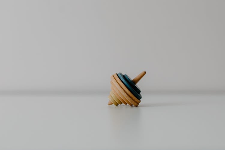 Close-up Shot Of A Wooden Top Toy 