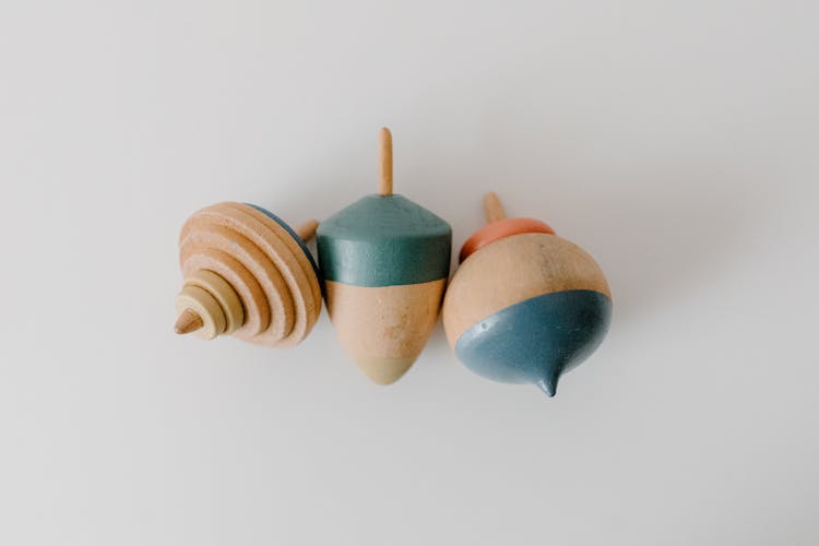 Close-Up Photo Of Wooden Spinning Tops