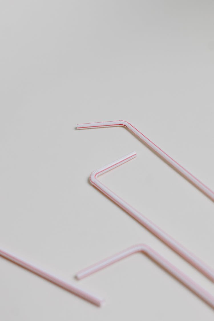 A Drinking Straws On A White Surface