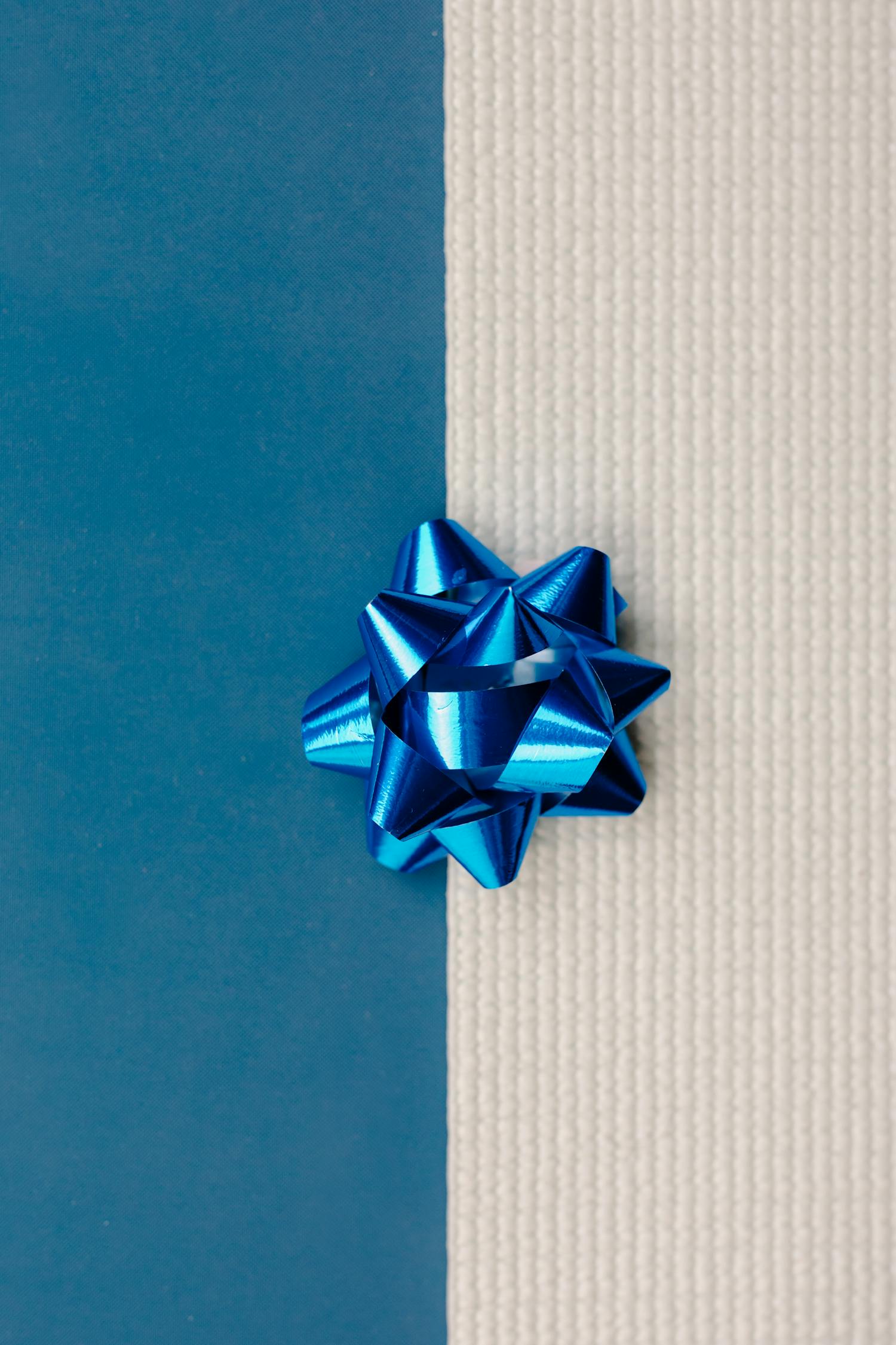 Blue and White Ribbon on Blue and White Textile · Free Stock Photo