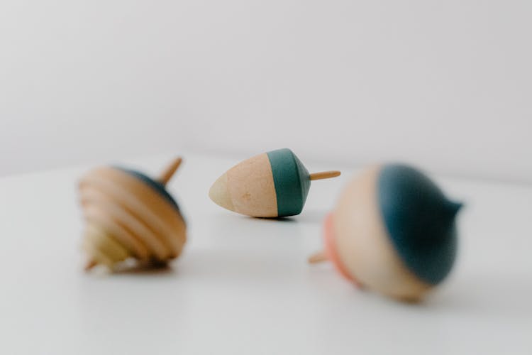 Close-Up Shot Of Wooden Spinning Tops