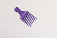 Purple Hair Comb on White Surface