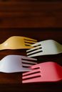 White Plastic Fork on Brown Wooden Table
