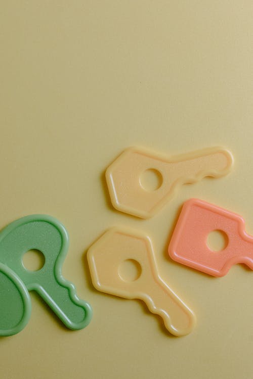 Plastic Keys Toy on Yellow Surface