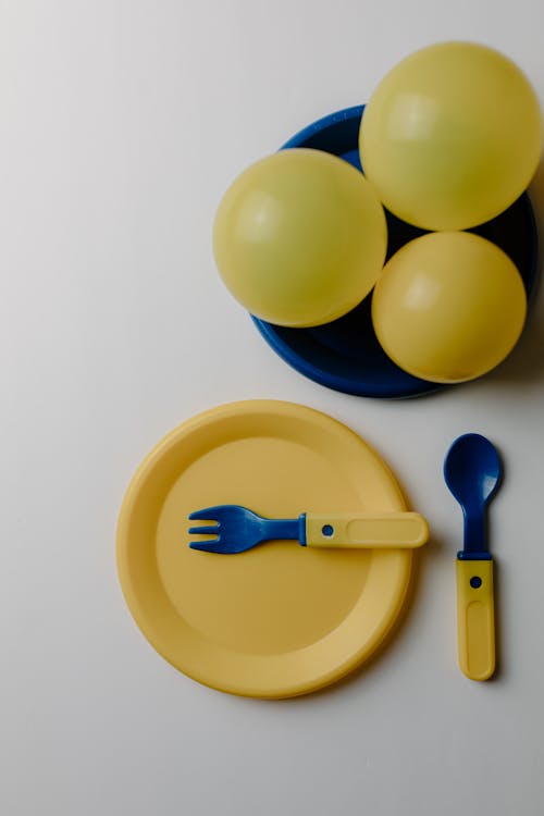Free Plastic Tableware and Balloons Stock Photo
