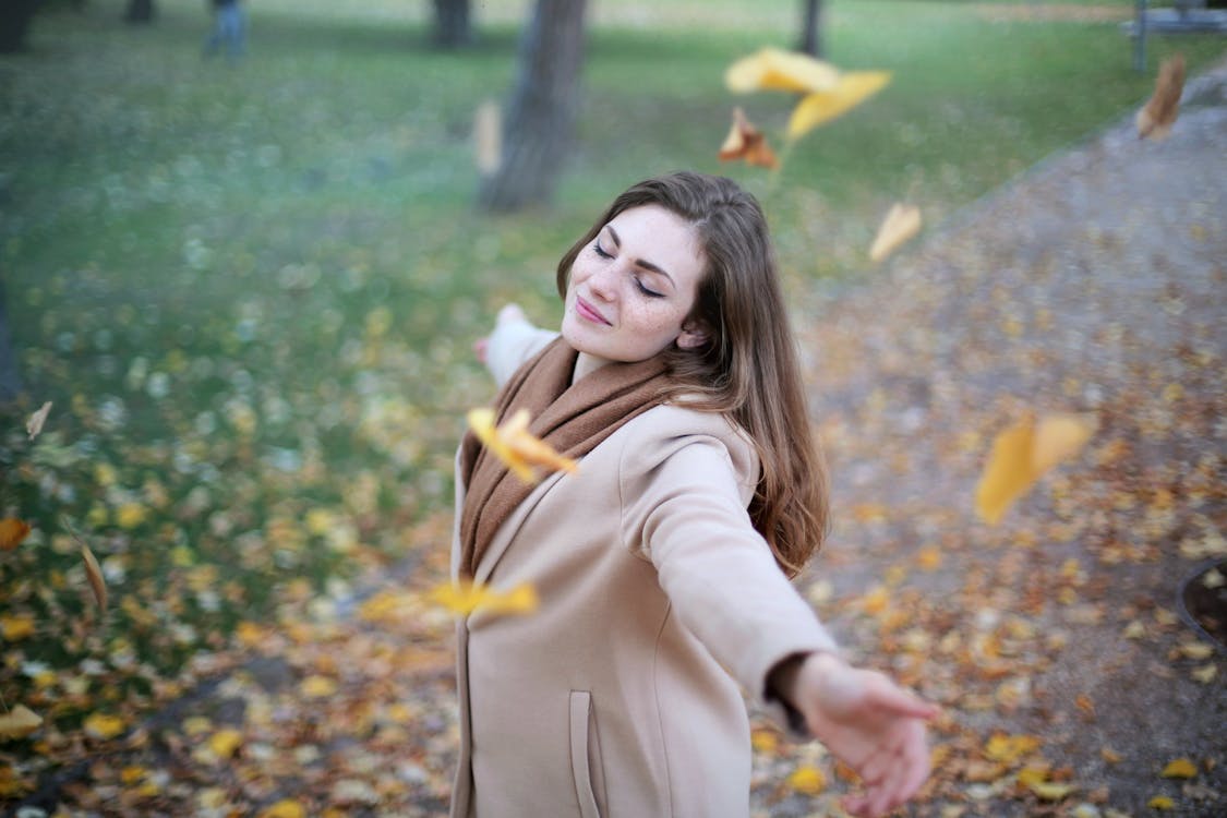 Free Woman Open Arms While Closed-eyes Smiling Photo Stock Photo