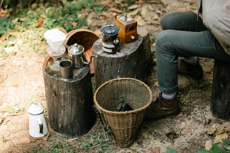 Crop Horticulturist Against Coffee Grinder And Gas Burner In Countryside