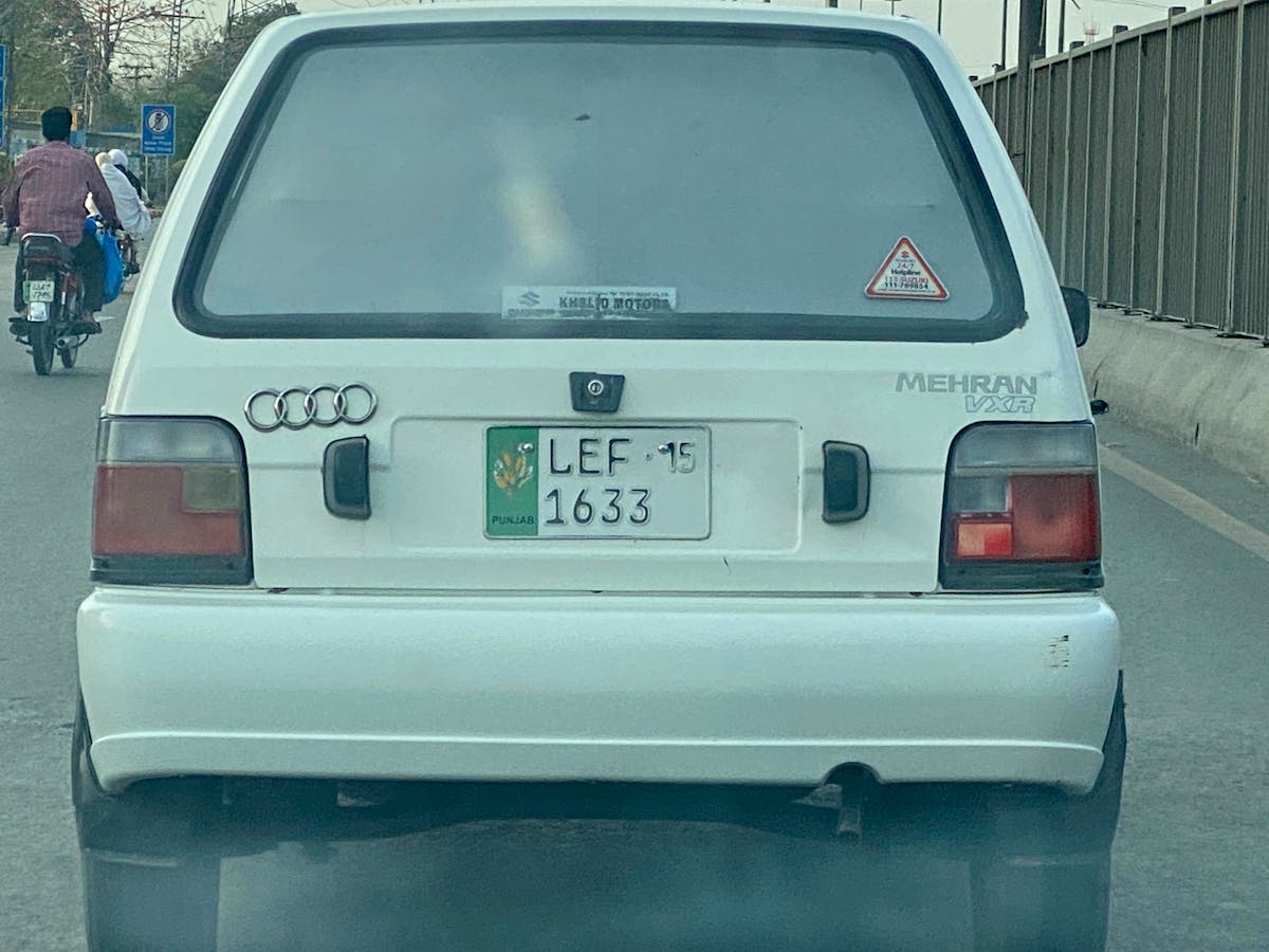 Animated style illustration of a person using a laptop in a dimly lit room