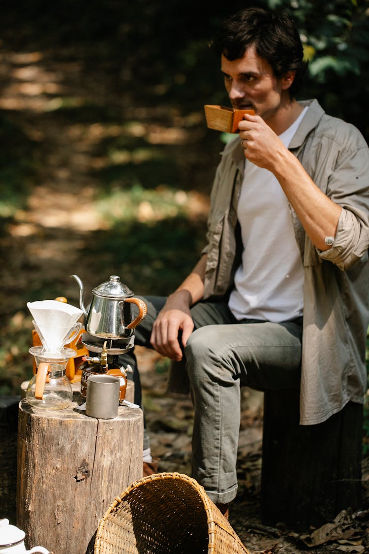 A Man Drinking Tea Outdoors