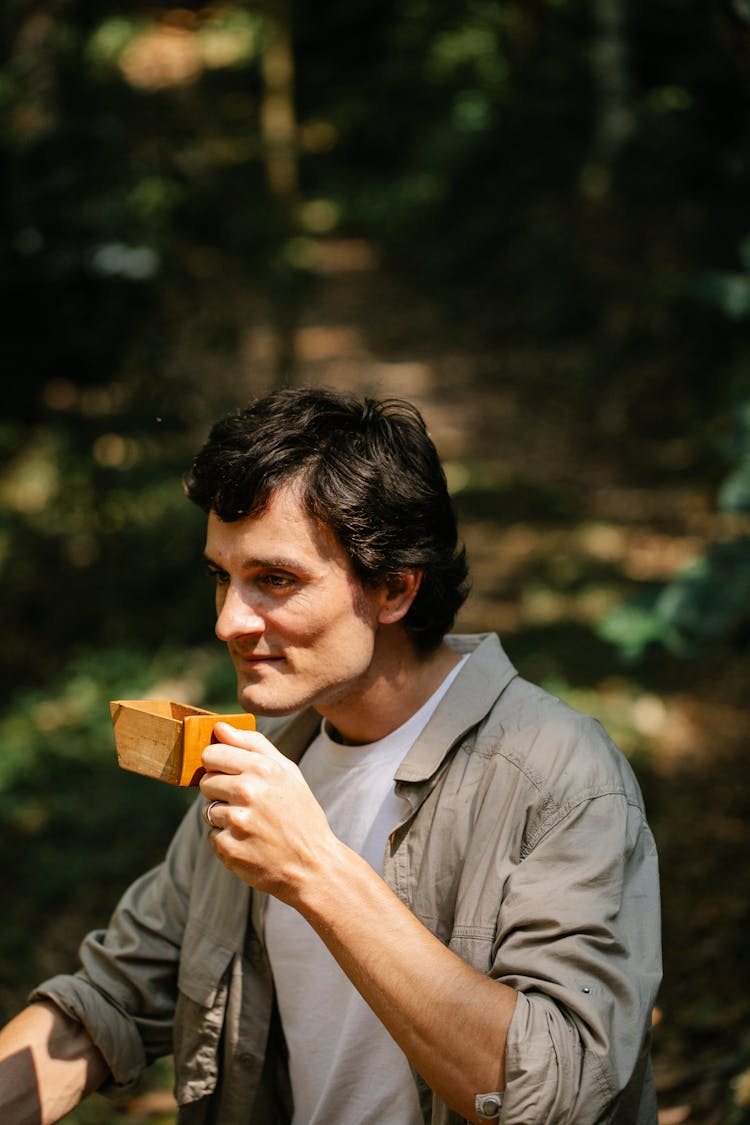 Content Man With Drawer Of Coffee Grinder