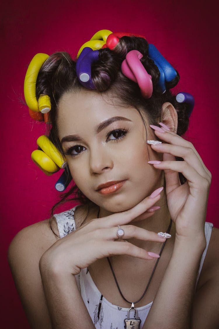 A Girl Wearing Hair Curlers