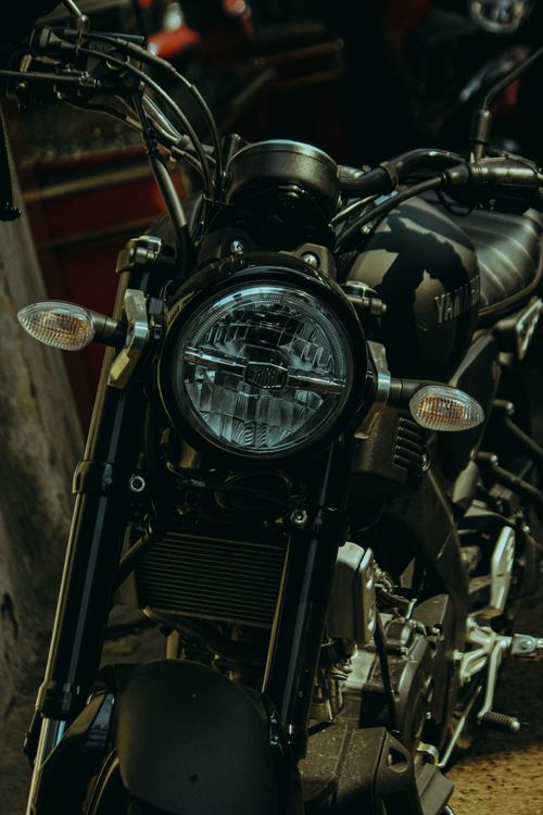 Free Close-up view of a Yamaha motorcycle headlight and handlebars. Stock Photo