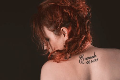 Redhead Woman with a Neck Tattoo 