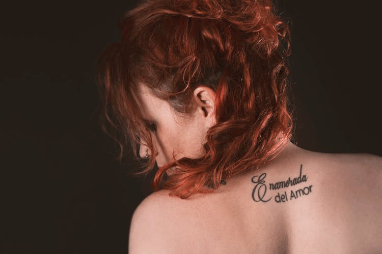 Redhead Woman With A Neck Tattoo 