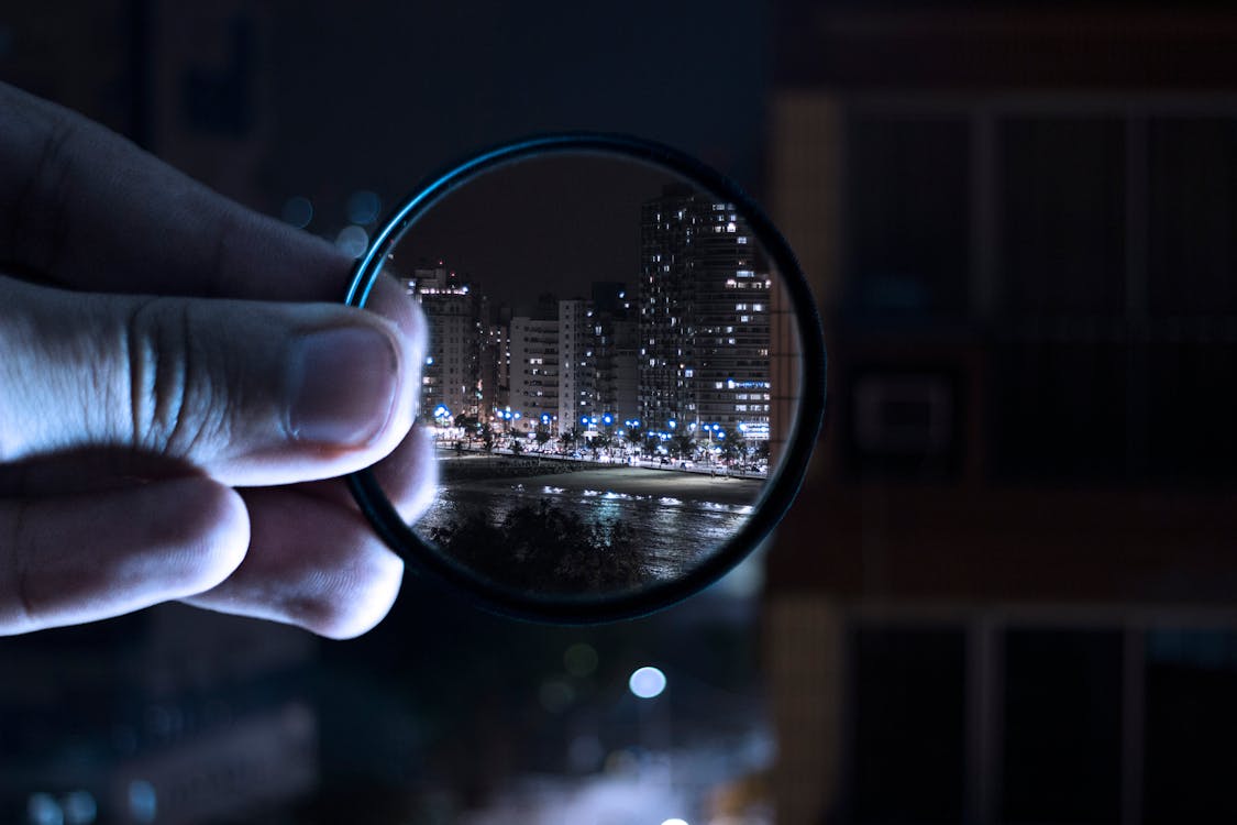 Free Person Holding Magnifying Glass Stock Photo