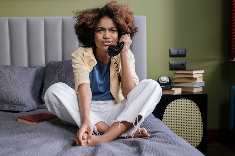 A Girl Talking On A Telephone