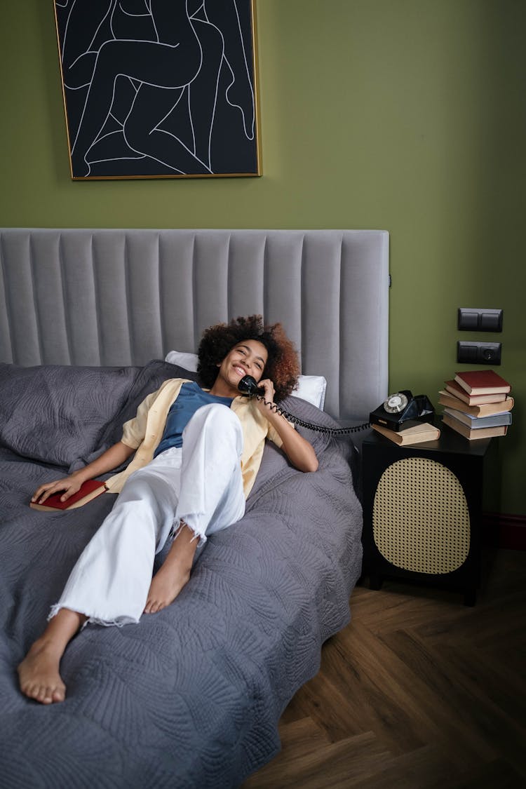 A Woman Talking On The Telephone