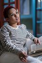 Woman in Black and White Striped Long Sleeve Shirt Reading Book
