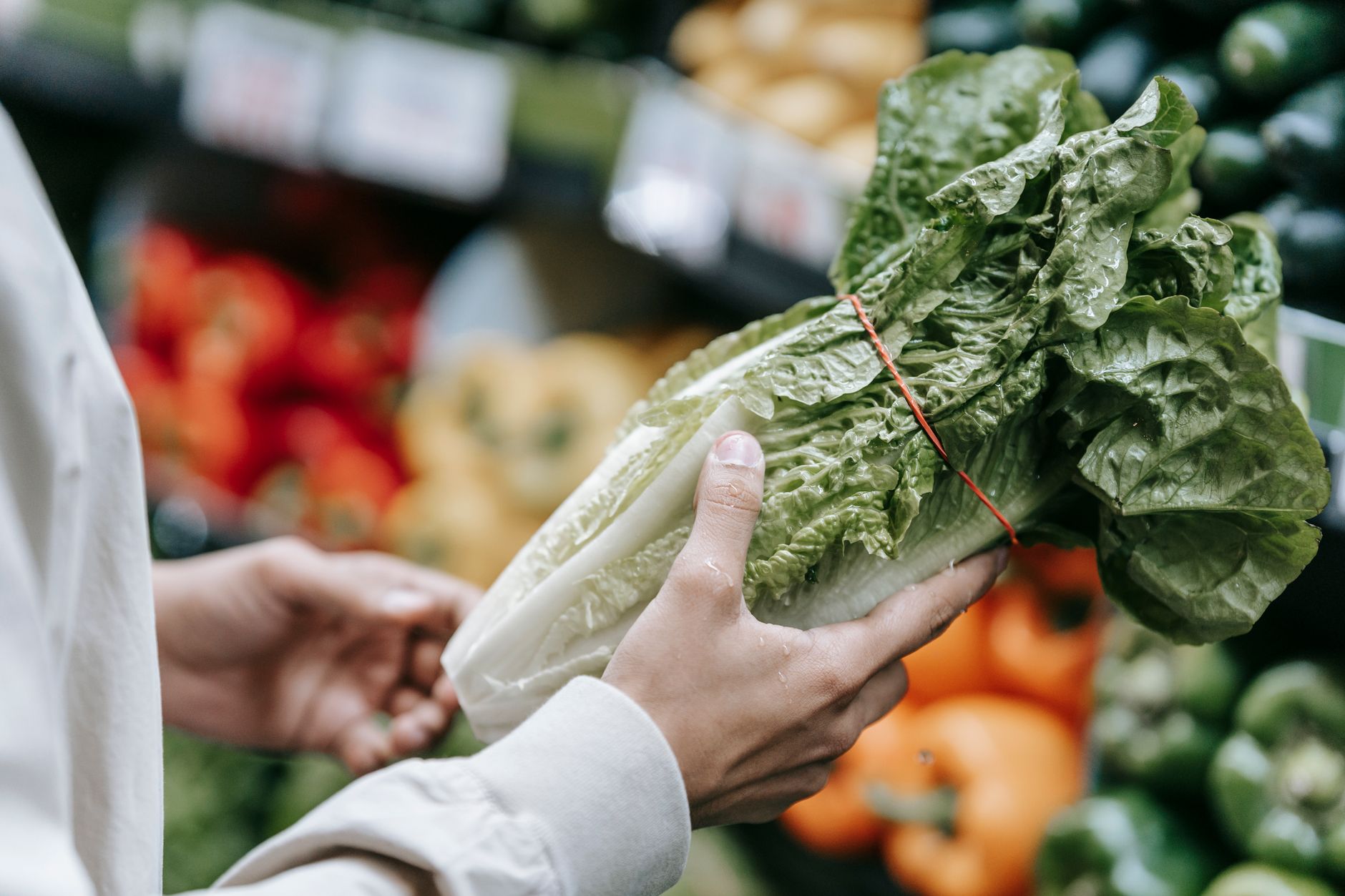 Supermarket plant-based vegan section with dairy alternatives and packaged foods