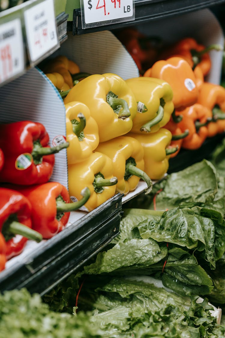 Fresh Assorted Colorful Bell Peppers And Herbs In Fridge On Supermarket