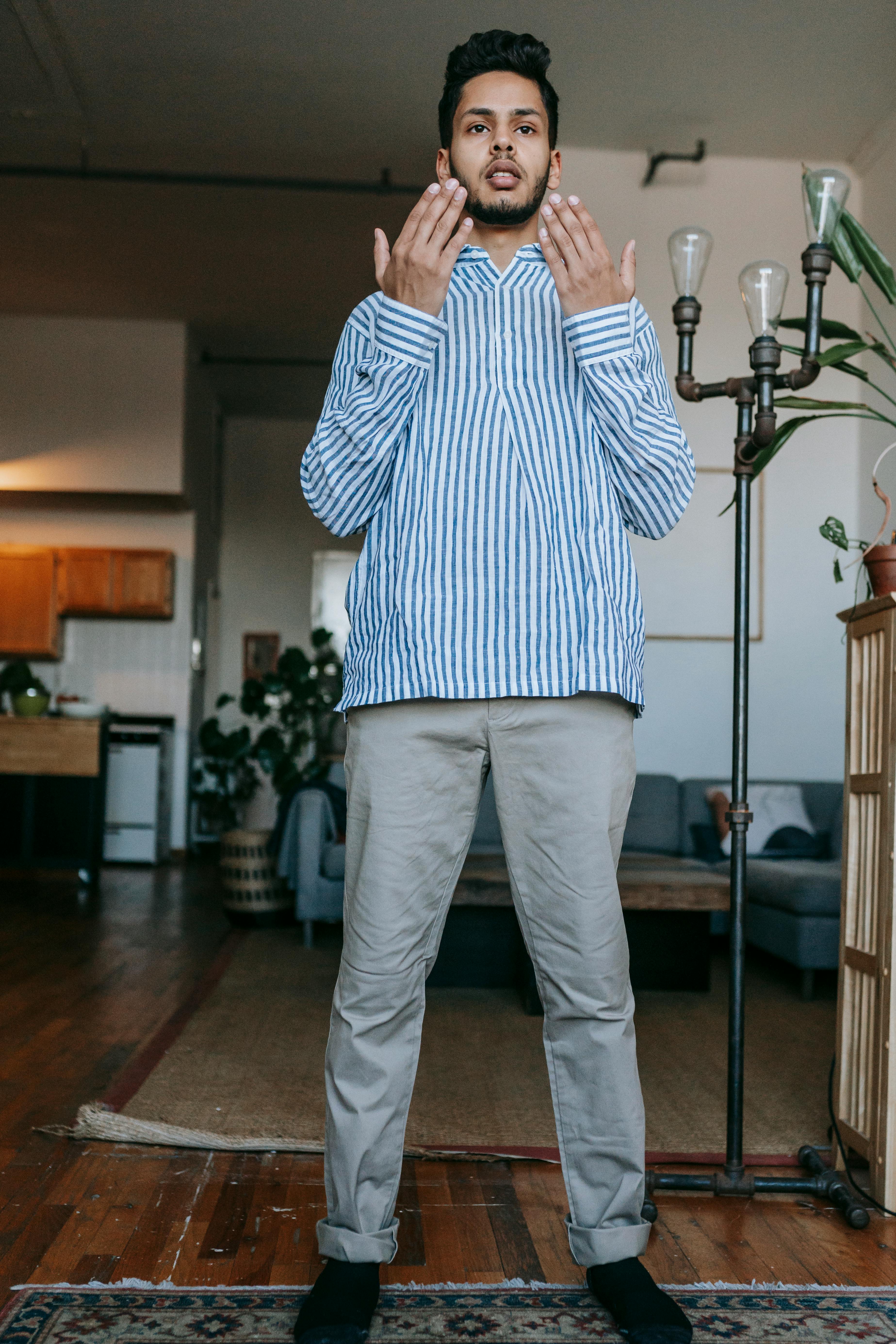 man in white and blue striped shirt