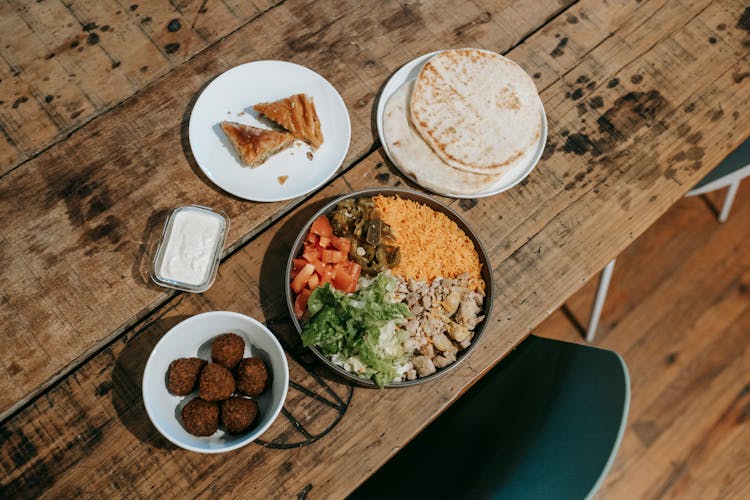 Various Traditional Indian Dishes Served On Table In Restaurant