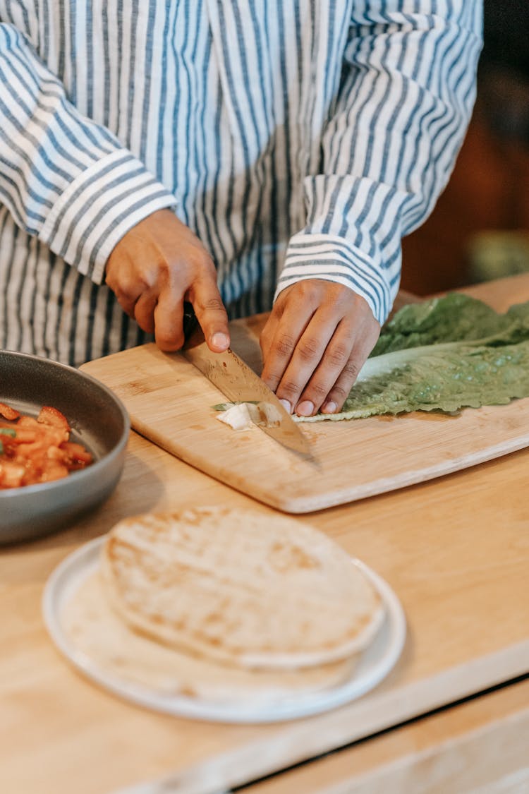 Chef Cutting Fresh Green Leaf Of Salad