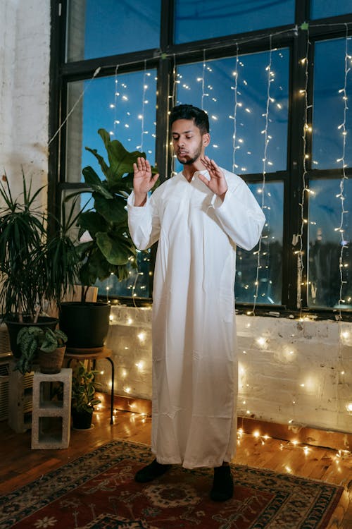 Man in White Thobe Praying