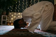 Man in White Thobe Praying