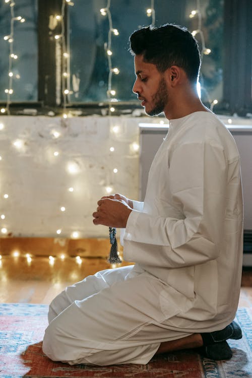 Man in White Thobe Praying