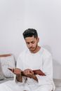 Person Holding a Quran