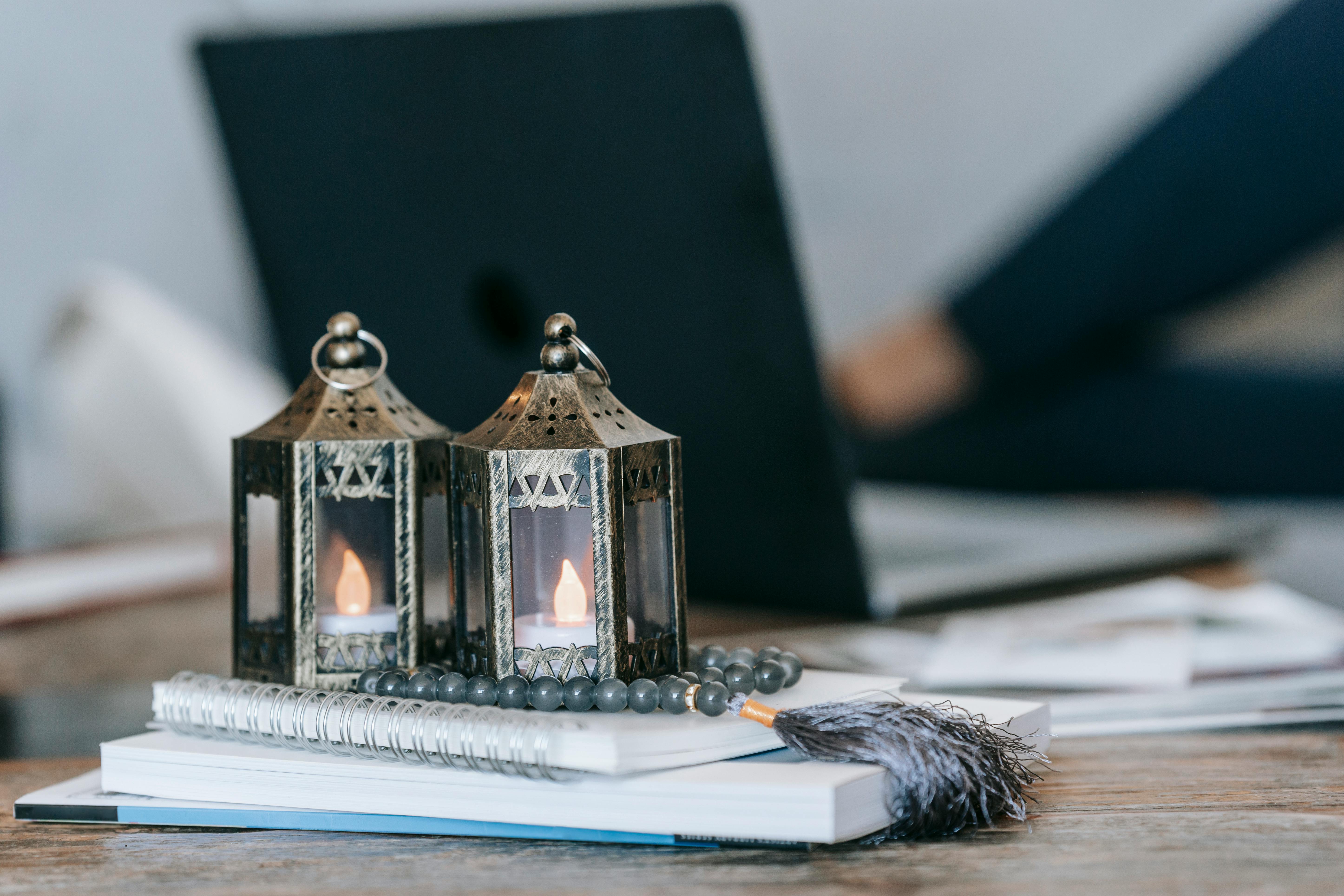 decorative lanterns and beads on desk at workplace