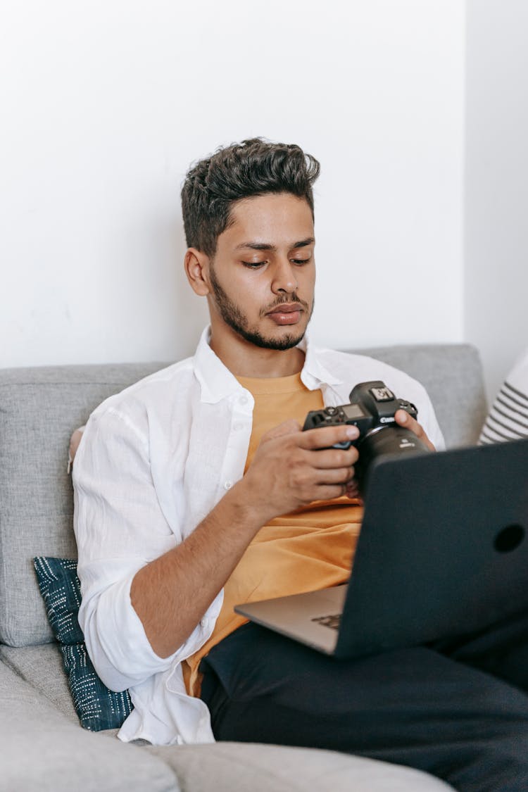 Man With Laptop Studying Photography Online