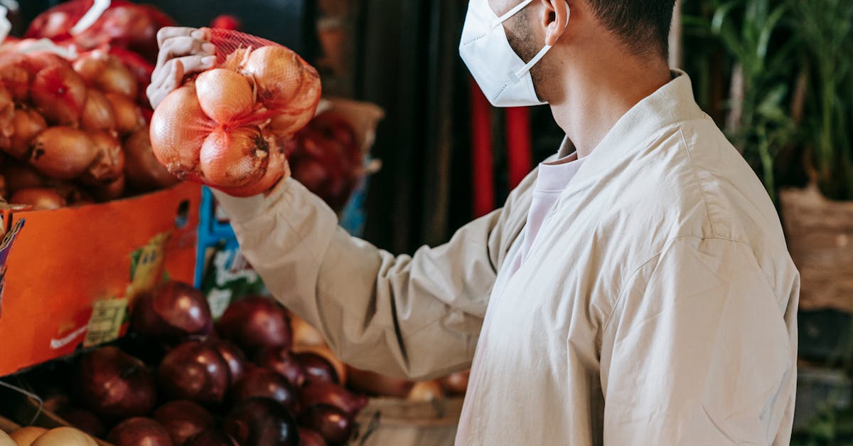 Ethnic man choosing goods in grocery market