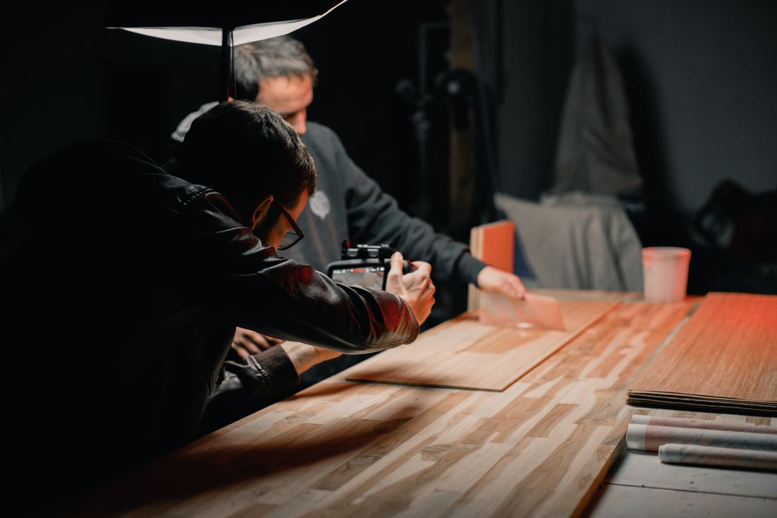 Two photographers collaborating on a creative studio shoot