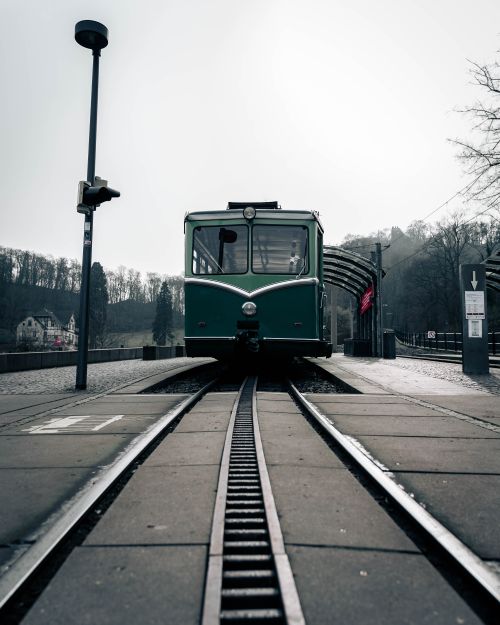 Free A classic green train on a misty day at a German railway station. Stock Photo