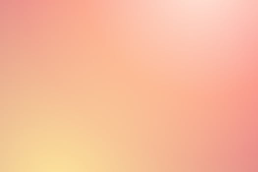 Soft abstract gradient background in pink and yellow hues