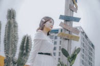 A Low Angle Shot of a Woman in White Off Shoulder Top