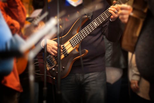 Man Holding Electric Bass Guitar
