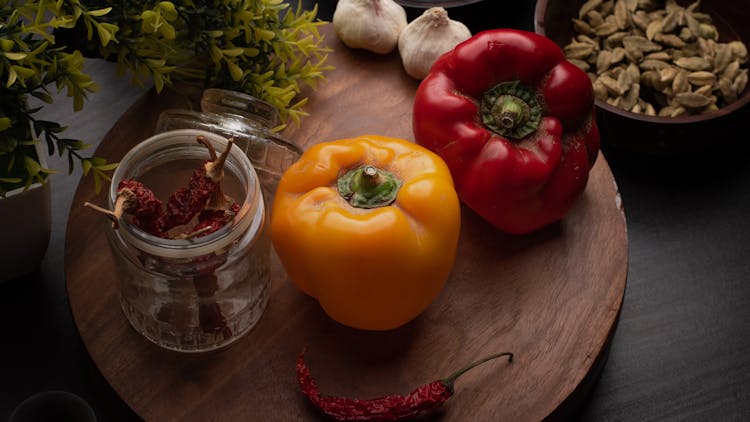 Photograph Of Bell Peppers Near Chili Peppers