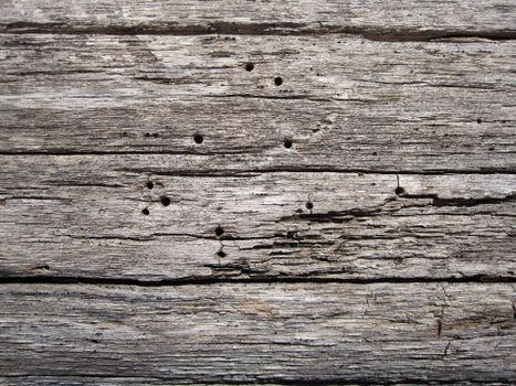 A close-up of weathered, rustic wooden planks showcasing natural texture.