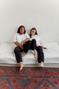 2 Women Lying on Bed