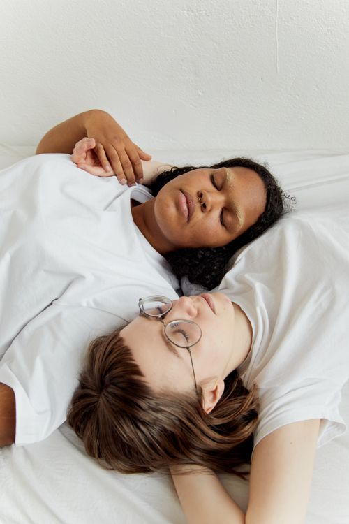 Free A couple peacefully resting together, embodying love and intimacy indoors. Stock Photo