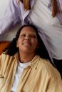 Woman in White Crew Neck Shirt Lying on Bed