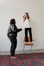 Man and Woman Standing Beside Wall