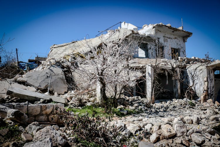 An Old Collapsed House Under Blue Sky