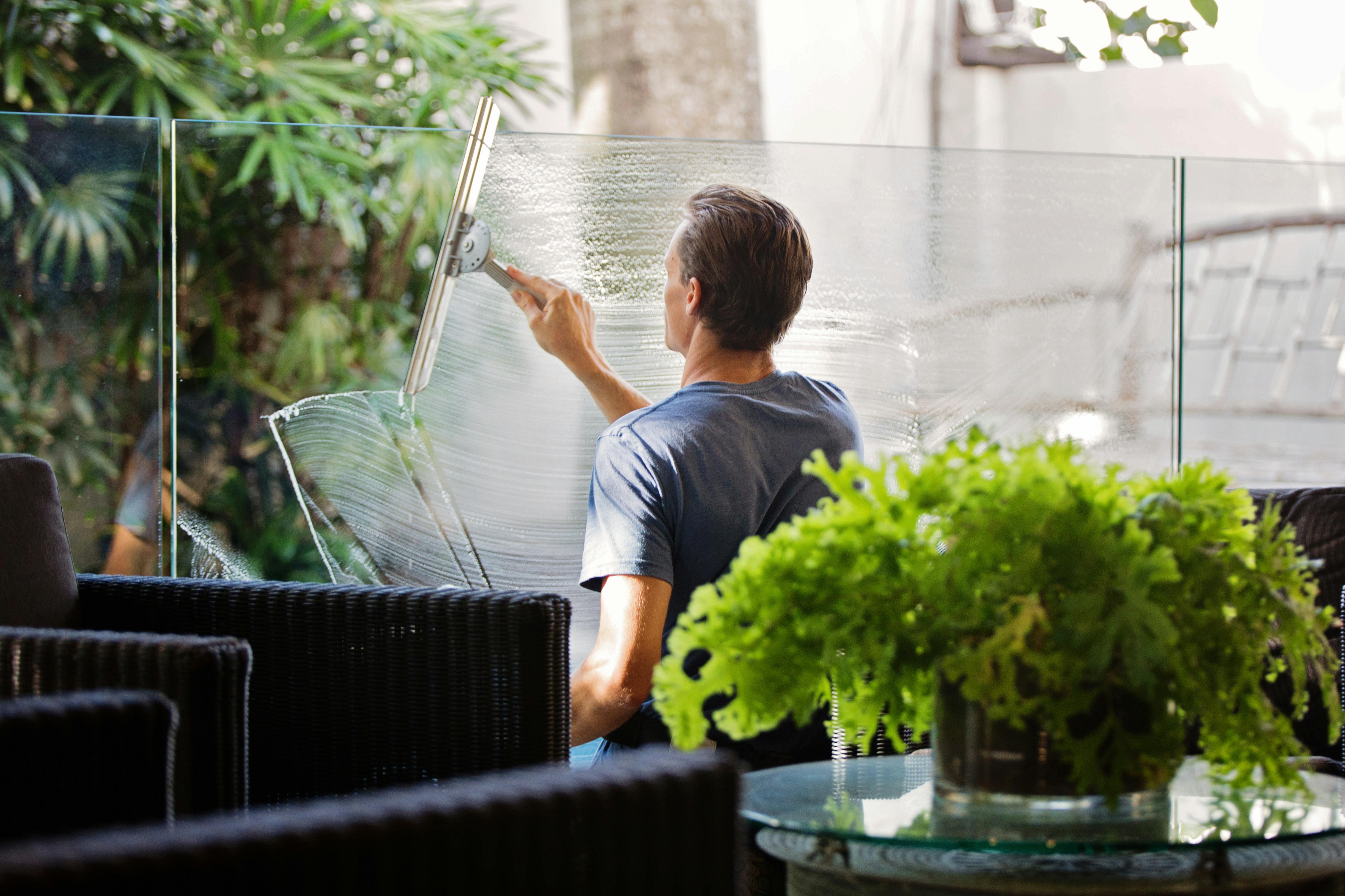 Man cleaning a window