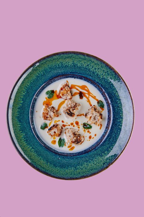 Free Top-down view of a beautifully plated gourmet dish on a pink background, showcasing culinary art. Stock Photo