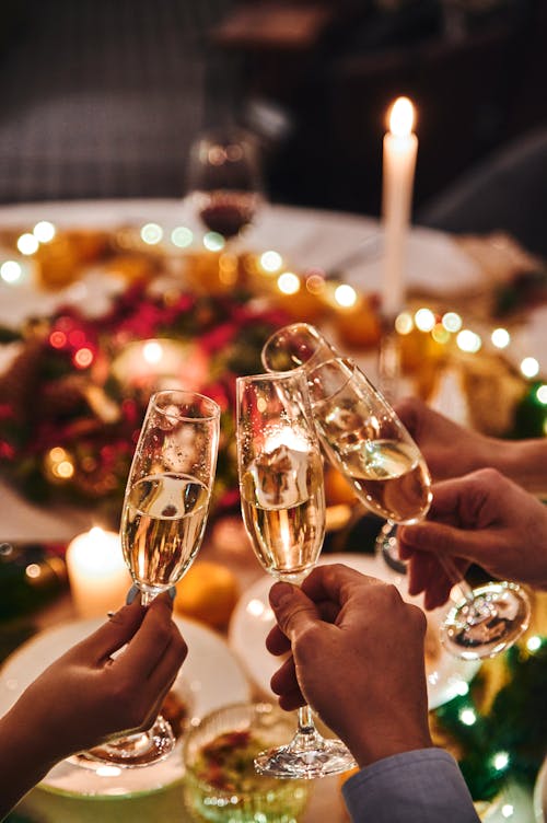Free People Holding Glasses of Champagne Stock Photo